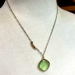 Green faceted peridot stone gold tone chain hardware necklace